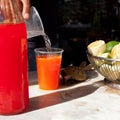 Seltzer Soda Drink in Sicily `Selz` Ã¢â¬â Traditional Italian Kiosk Background with Red Orange Drink and Lemons on Marble